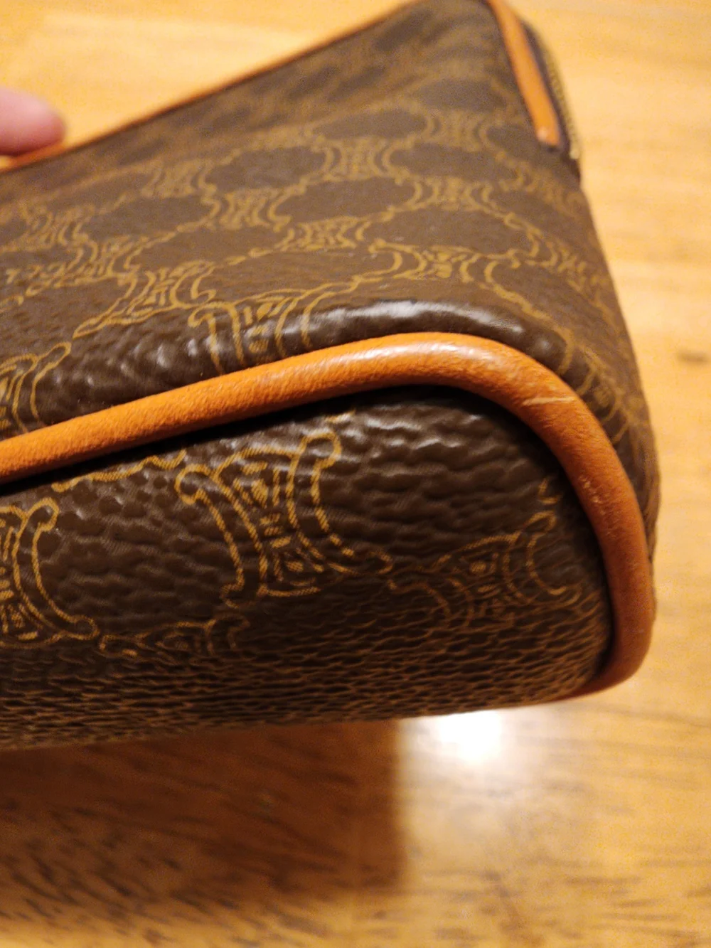 CELINE pouch is crafted from brown Triomphe canvas and features tan leather trim